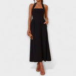 Isidora | Vestido midi negro con cuello halter y detalle en la cintura
