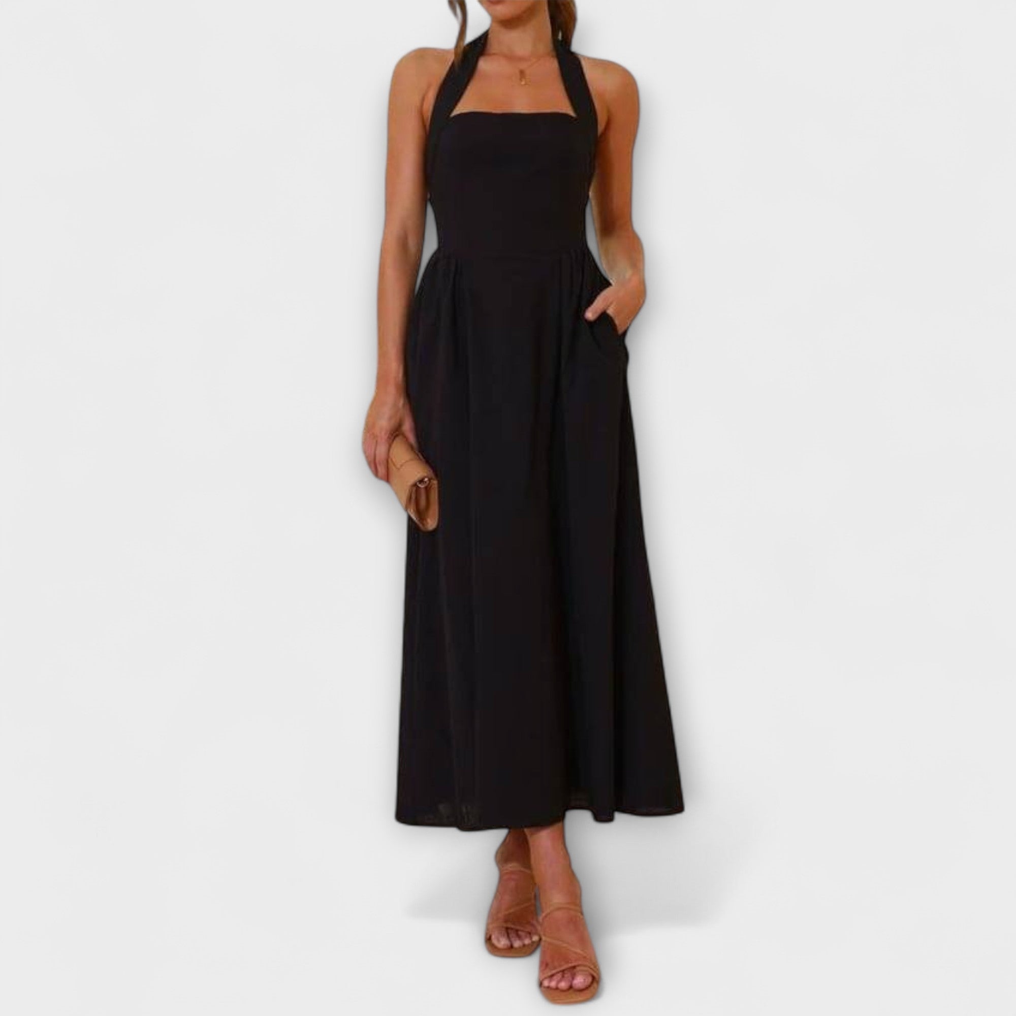 Isidora | Vestido midi negro con cuello halter y detalle en la cintura