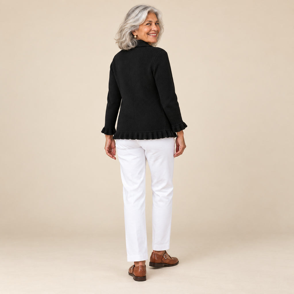 Yaiza | Chaqueta de punto de canalé negra con volantes, vista de espaldas