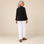 Yaiza | Chaqueta de punto de canalé negra con volantes, vista de espaldas