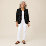 Yaiza | Chaqueta de punto de canalé negra con volantes, vista de frente